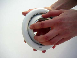 Illustration for article titled Sens Time By Touch Clock For The Blind Is Sexy And Round